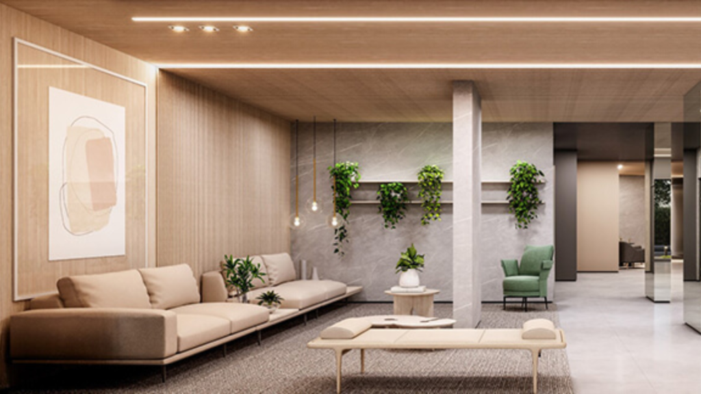 Hall de entrada de edifício de alto padrão, com mobiliário sofisticado e decoração moderna, representando a importância da segurança contra incêndio em empreendimentos de alto padrão.